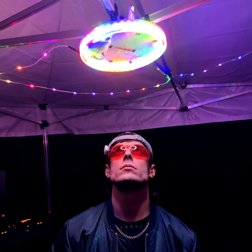 Party UFO hung up in camp with the fairy-light strung under the canopy